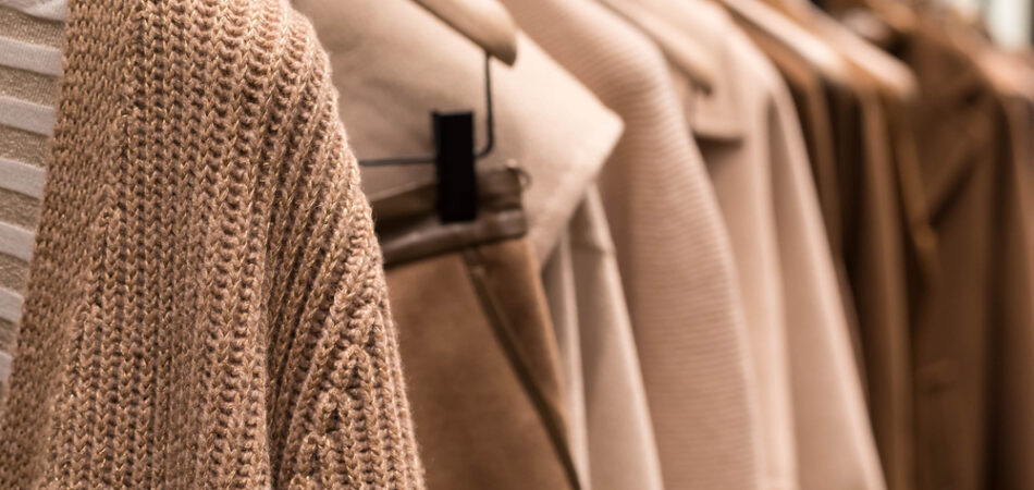 Coat,and,sweater,light,brown,on,the,hanger,in,the